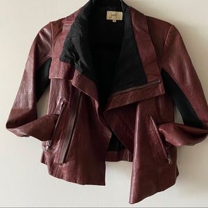 Stunning burgundy leather jacket made by June. Collar zips all the way up!